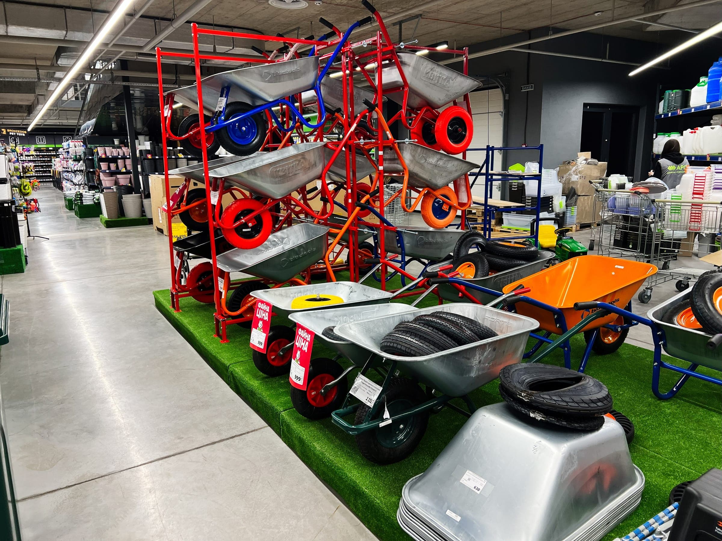 Wheelbarrows and garden carts on display racks