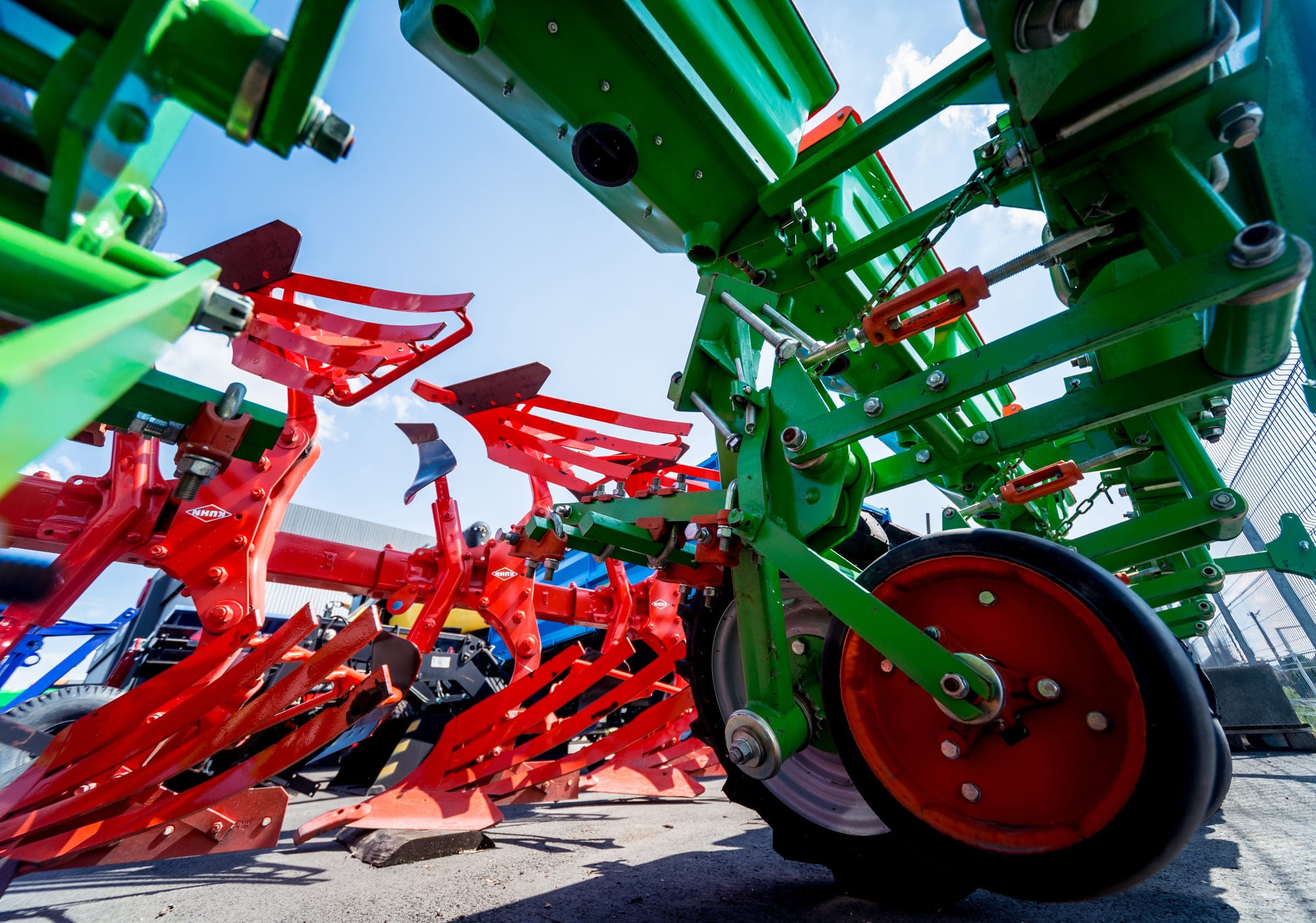 Ploughs and cultivators seen from a low angle