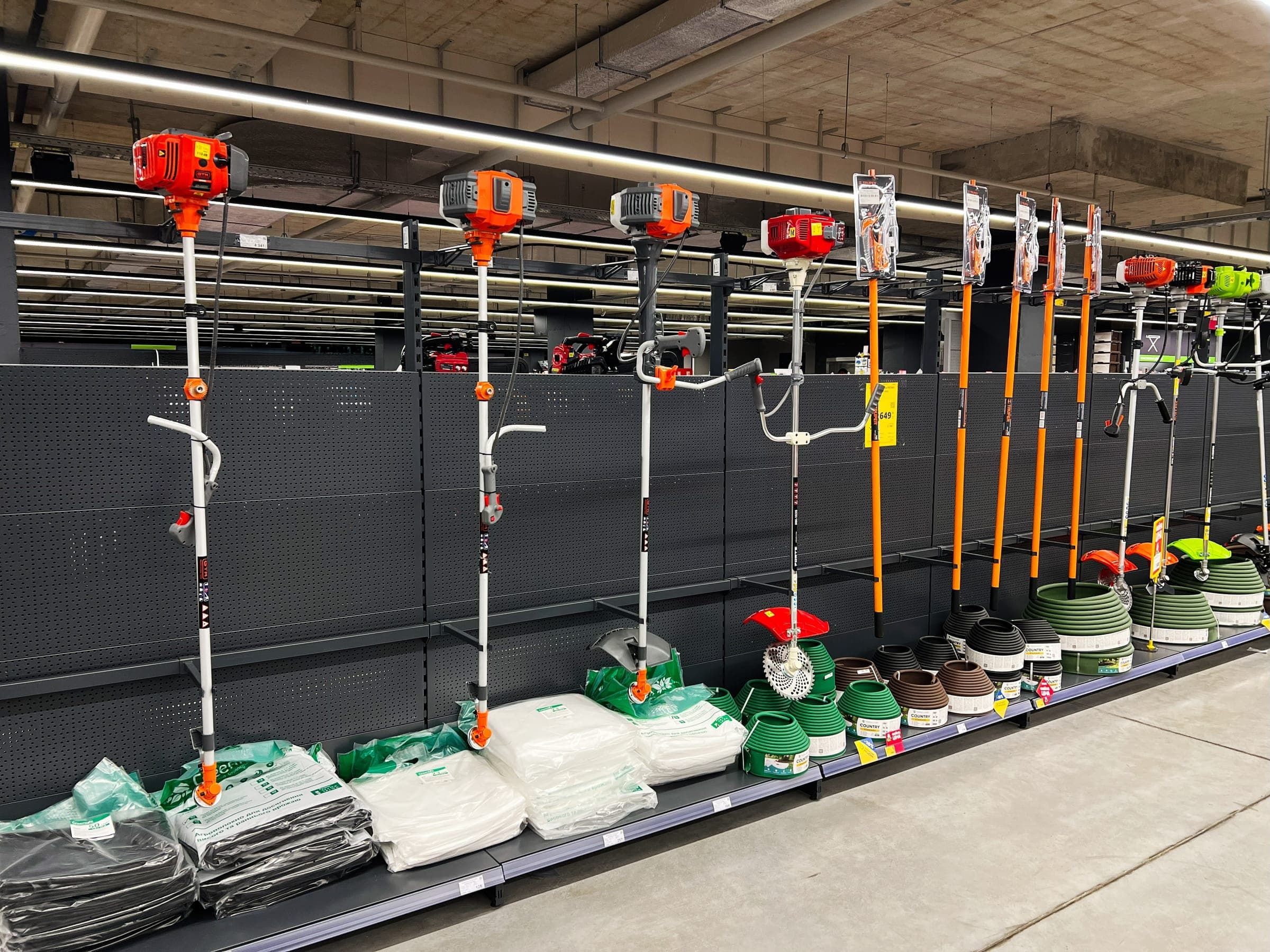 Rack of petrol trimmers and brush cutters