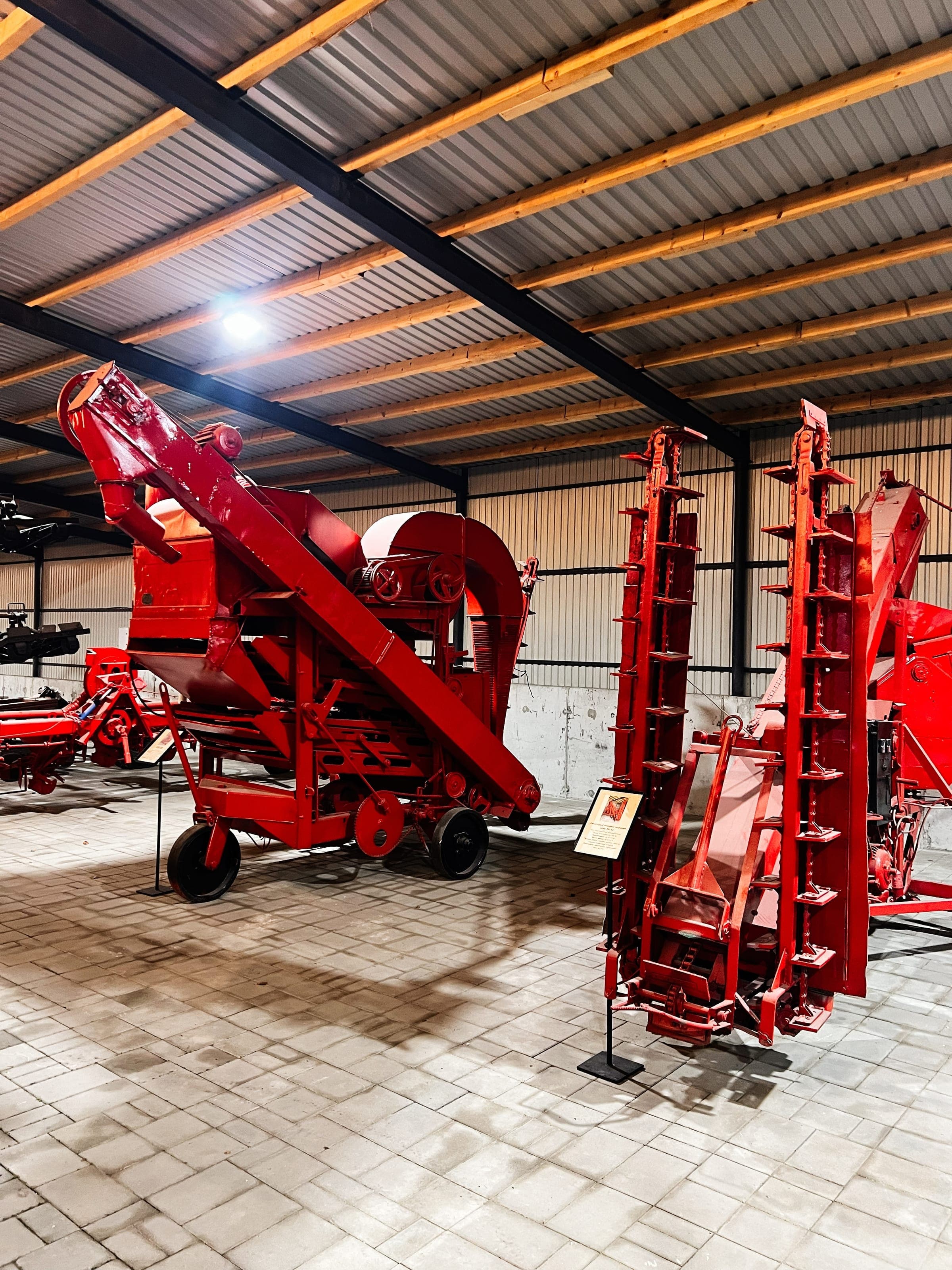 Red grain elevator and thresher on display