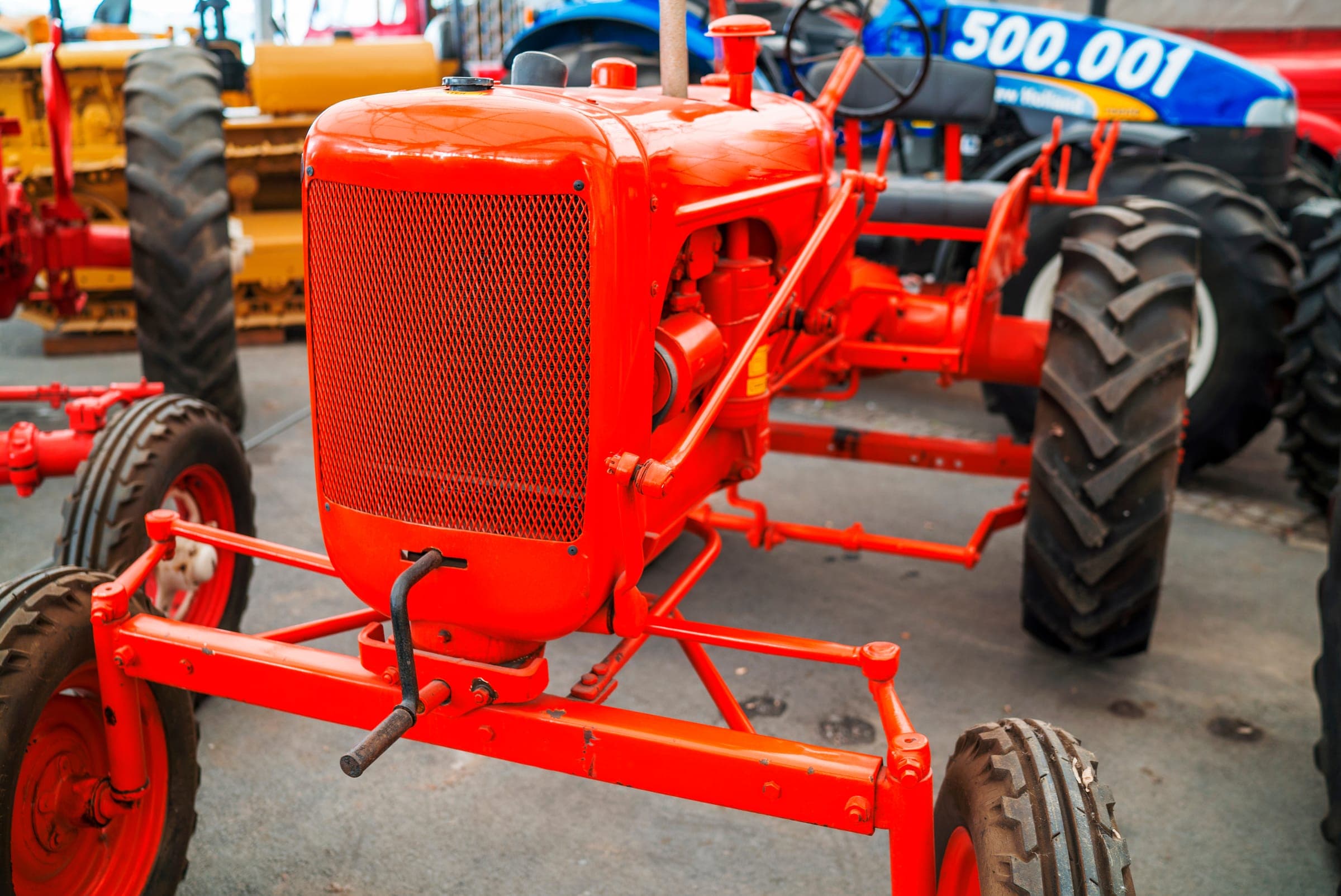 Vintage orange tractor in a machinery museum