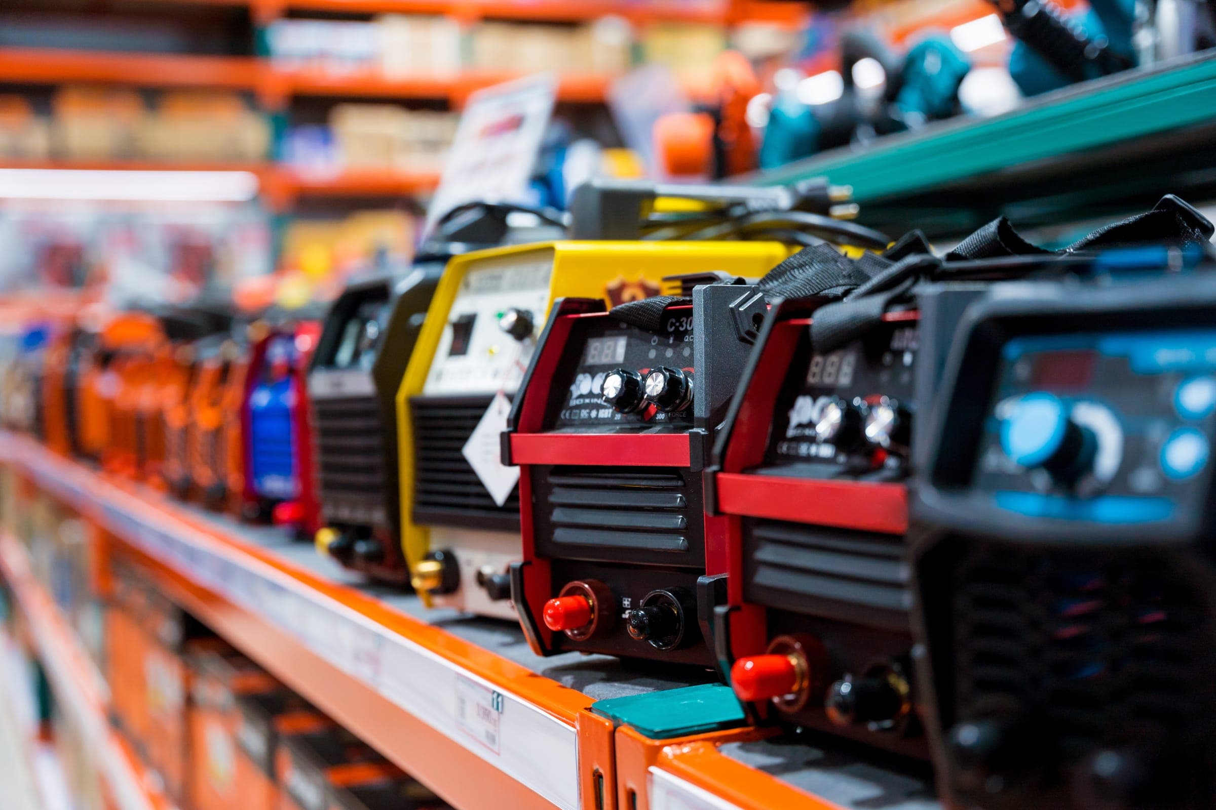 Welding machines and power equipment on a shop shelf